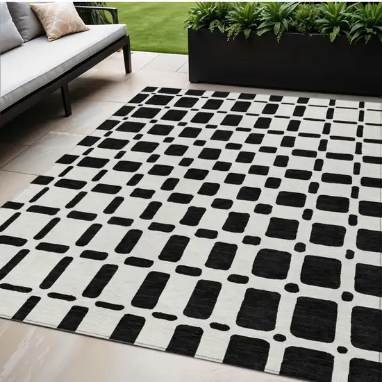Black And Ivory Geometric Washable Indoor Outdoor Area Rug Photo 1