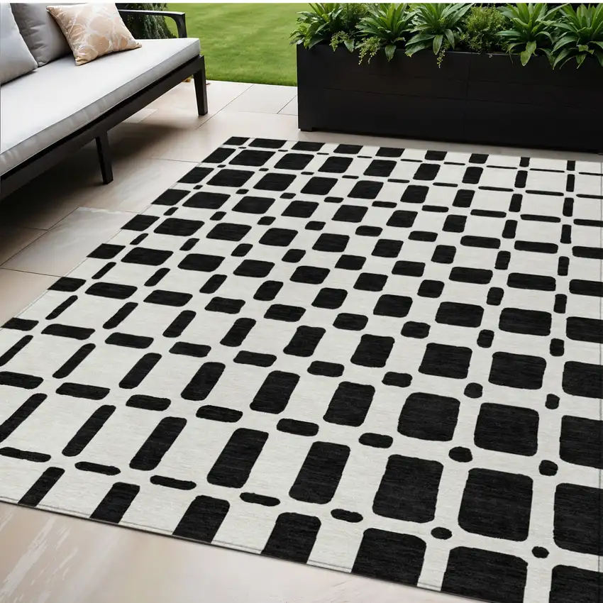Black And Ivory Geometric Washable Indoor Outdoor Area Rug Photo 1