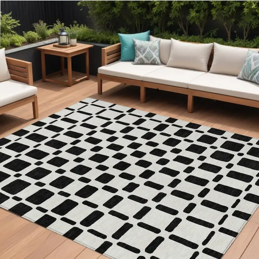 Black And Ivory Geometric Washable Indoor Outdoor Area Rug Photo 1