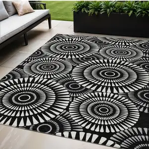 Photo of Black And Ivory Geometric Washable Indoor Outdoor Area Rug