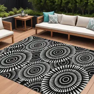 Photo of Black And Ivory Geometric Washable Indoor Outdoor Area Rug