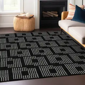 Photo of Black And Ivory Geometric Washable Indoor Outdoor Area Rug