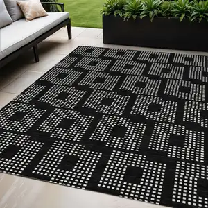 Photo of Black And Ivory Geometric Washable Indoor Outdoor Area Rug