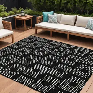 Photo of Black And Ivory Geometric Washable Indoor Outdoor Area Rug