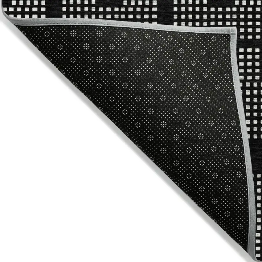 Black And Ivory Geometric Washable Indoor Outdoor Area Rug Photo 4