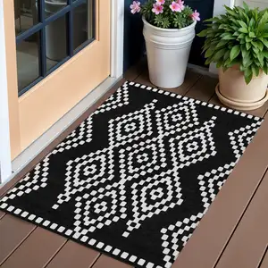 Photo of Black And Ivory Geometric Washable Indoor Outdoor Area Rug