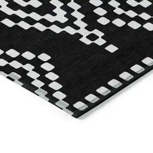 Photo of Black And Ivory Geometric Washable Indoor Outdoor Area Rug