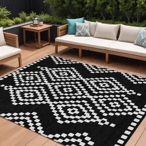 Photo of Black And Ivory Geometric Washable Indoor Outdoor Area Rug