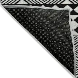 Photo of Black And Ivory Geometric Washable Indoor Outdoor Area Rug