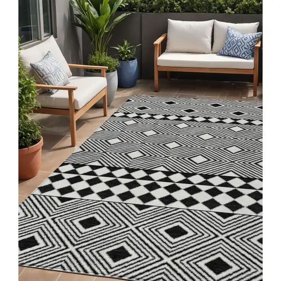 Black And Ivory Geometric Washable Indoor Outdoor Area Rug Photo 1