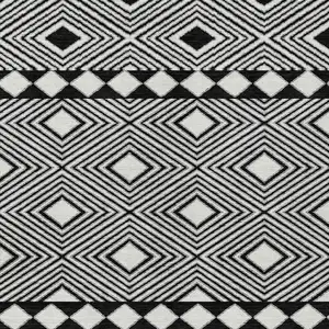 Photo of Black And Ivory Geometric Washable Indoor Outdoor Area Rug