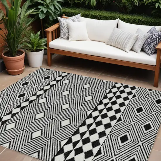 Black And Ivory Geometric Washable Indoor Outdoor Area Rug Photo 1