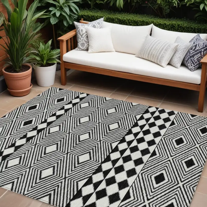 Black And Ivory Geometric Washable Indoor Outdoor Area Rug Photo 1