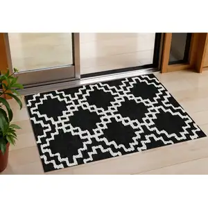 Photo of Black And Ivory Geometric Washable Indoor Outdoor Area Rug