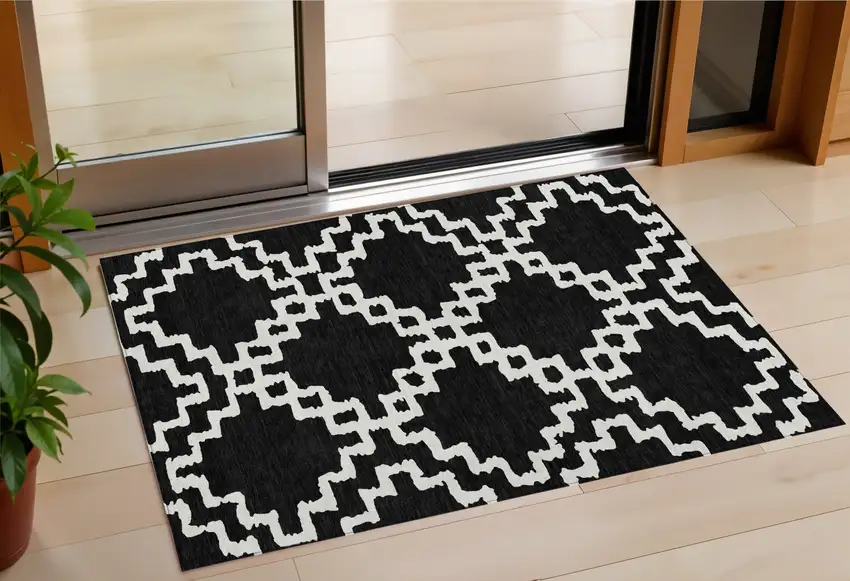 Black And Ivory Geometric Washable Indoor Outdoor Area Rug Photo 1