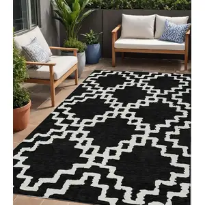 Photo of Black And Ivory Geometric Washable Indoor Outdoor Area Rug
