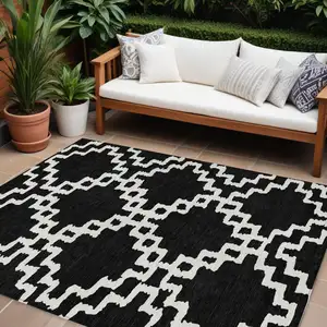 Photo of Black And Ivory Geometric Washable Indoor Outdoor Area Rug