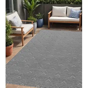 Photo of Black And Ivory Geometric Washable Indoor Outdoor Area Rug