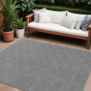 Photo of Black And Ivory Geometric Washable Indoor Outdoor Area Rug