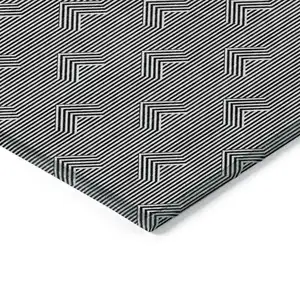 Photo of Black And Ivory Geometric Washable Indoor Outdoor Area Rug