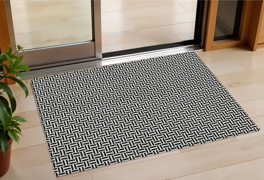 Black And Ivory Geometric Washable Indoor Outdoor Area Rug Photo 1