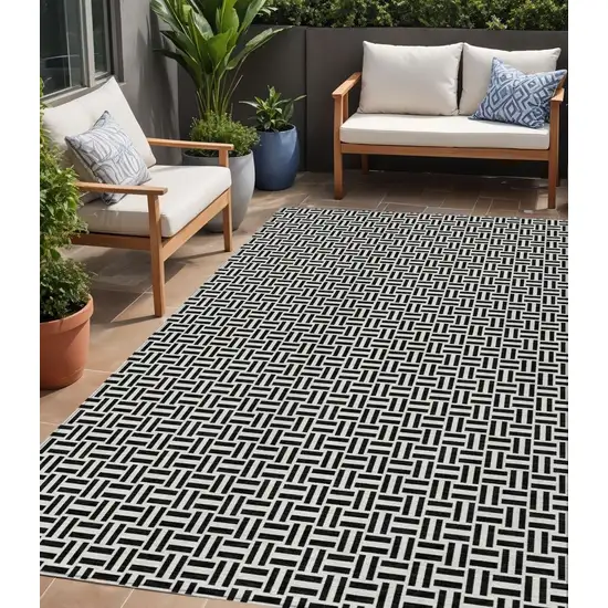 Black And Ivory Geometric Washable Indoor Outdoor Area Rug Photo 1