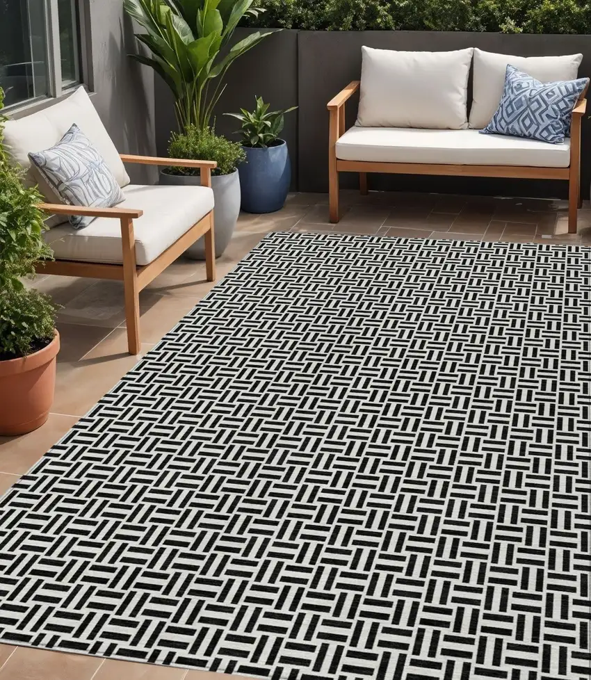 Black And Ivory Geometric Washable Indoor Outdoor Area Rug Photo 1