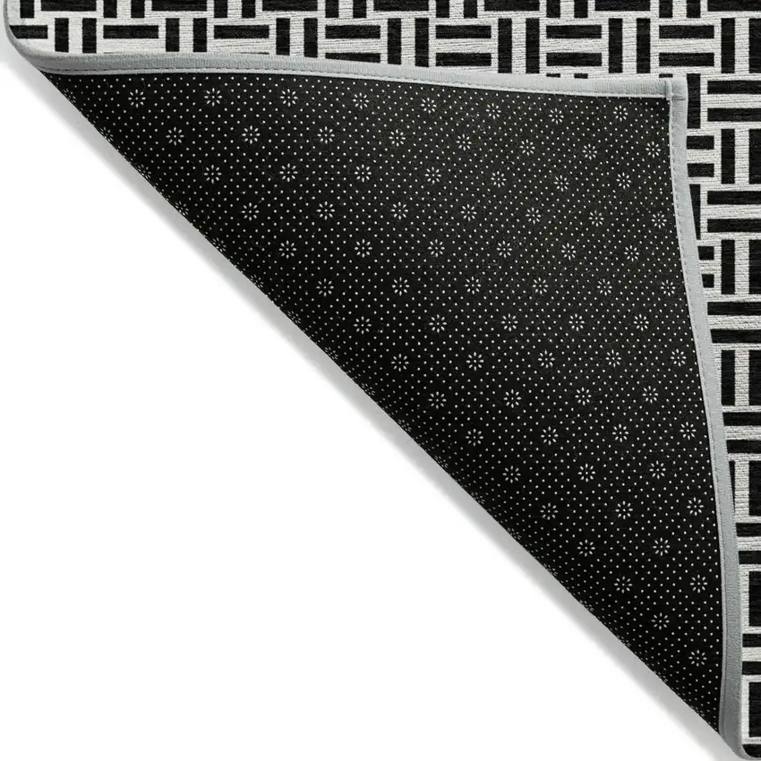 Black And Ivory Geometric Washable Indoor Outdoor Area Rug Photo 4
