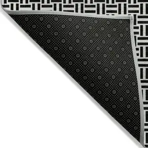 Photo of Black And Ivory Geometric Washable Indoor Outdoor Area Rug