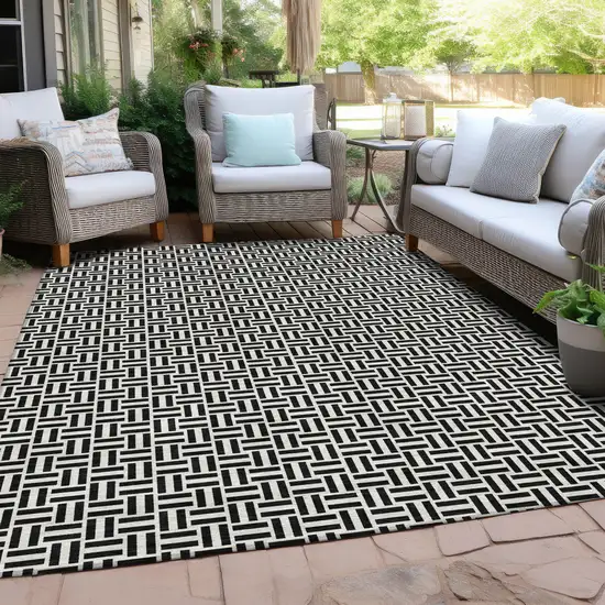 Black And Ivory Geometric Washable Indoor Outdoor Area Rug Photo 9