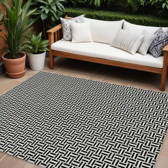 Black And Ivory Geometric Washable Indoor Outdoor Area Rug Photo 1