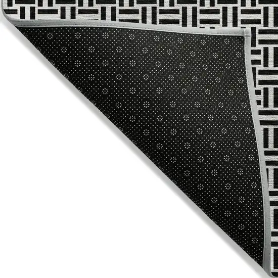 Black And Ivory Geometric Washable Indoor Outdoor Area Rug Photo 4