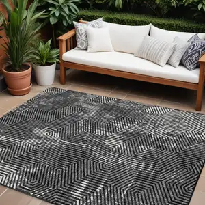 Photo of Black And Ivory Geometric Washable Indoor Outdoor Area Rug