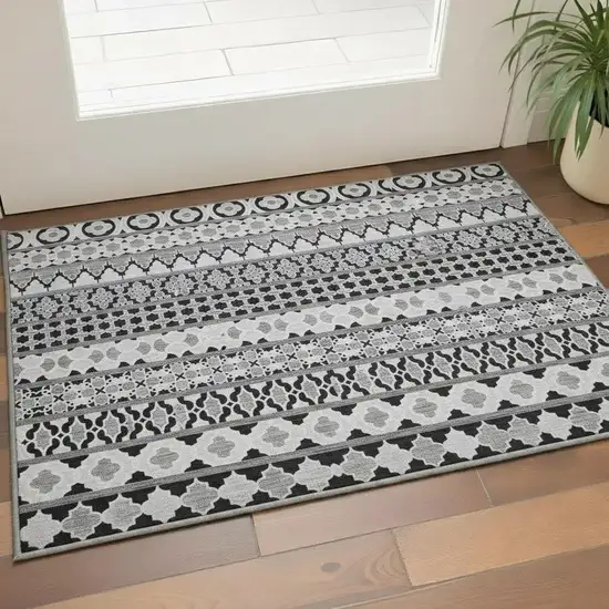 Black And Ivory Ikat Washable Area Rug With UV Protection Photo 2