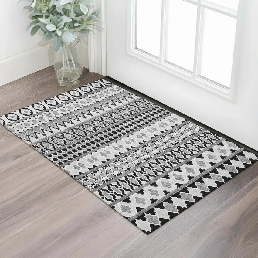 Black And Ivory Ikat Washable Area Rug With UV Protection Photo 1