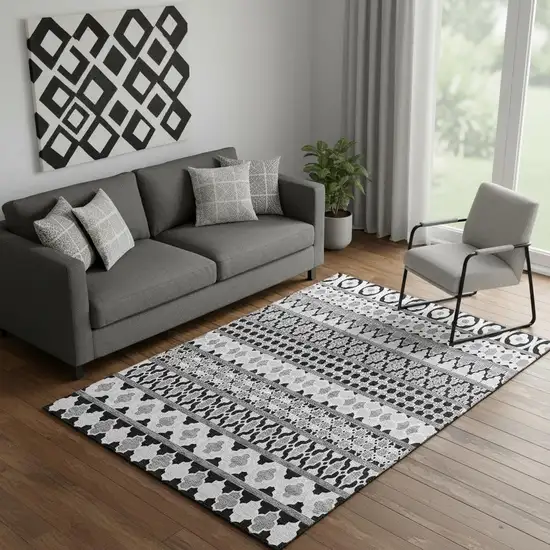 Black And Ivory Ikat Washable Area Rug With UV Protection Photo 1