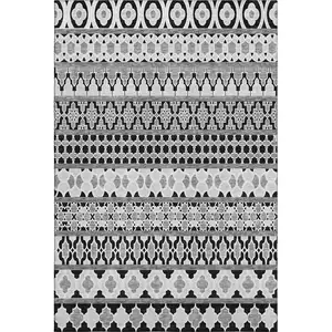 Photo of Black And Ivory Ikat Washable Area Rug With UV Protection