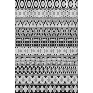 Photo of Black And Ivory Ikat Washable Area Rug With UV Protection