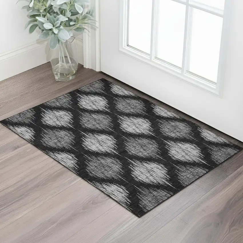 Black And Ivory Ikat Washable Area Rug With UV Protection Photo 1