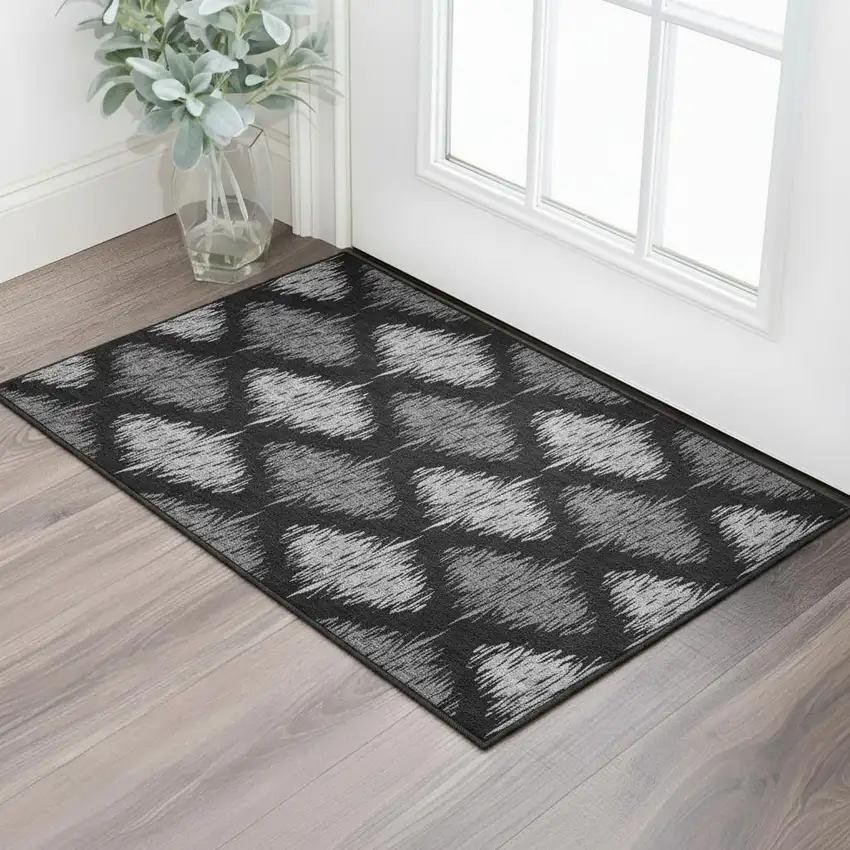 Black And Ivory Ikat Washable Area Rug With UV Protection Photo 2