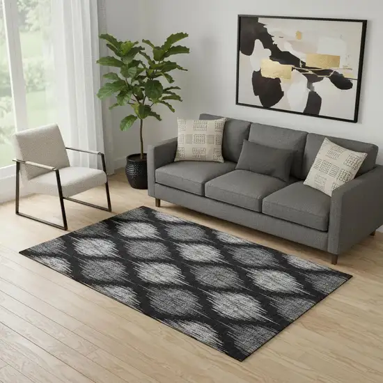 Black And Ivory Ikat Washable Area Rug With UV Protection Photo 1