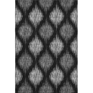 Photo of Black And Ivory Ikat Washable Area Rug With UV Protection