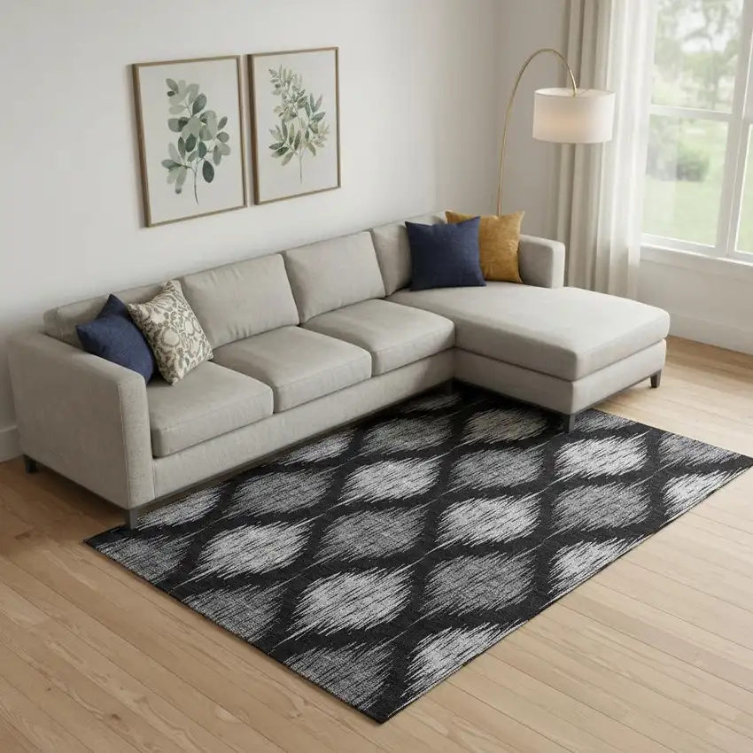 Black And Ivory Ikat Washable Area Rug With UV Protection Photo 1