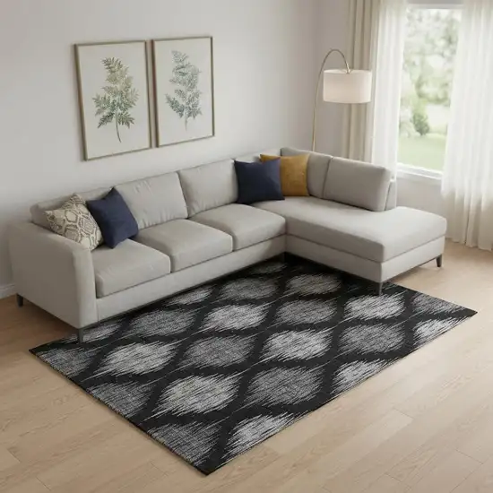 Black And Ivory Ikat Washable Area Rug With UV Protection Photo 1