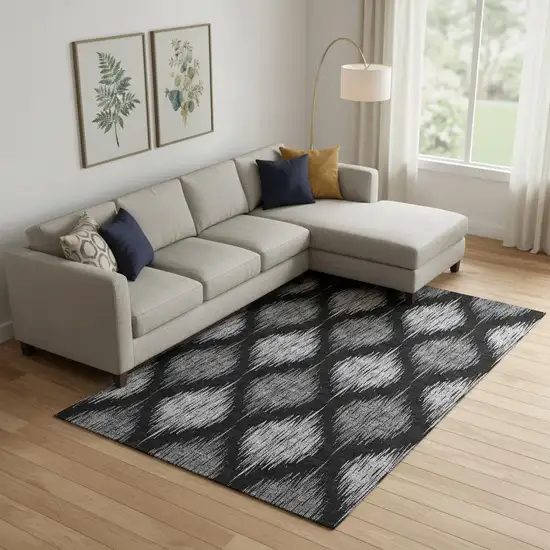 Black And Ivory Ikat Washable Area Rug With UV Protection Photo 1
