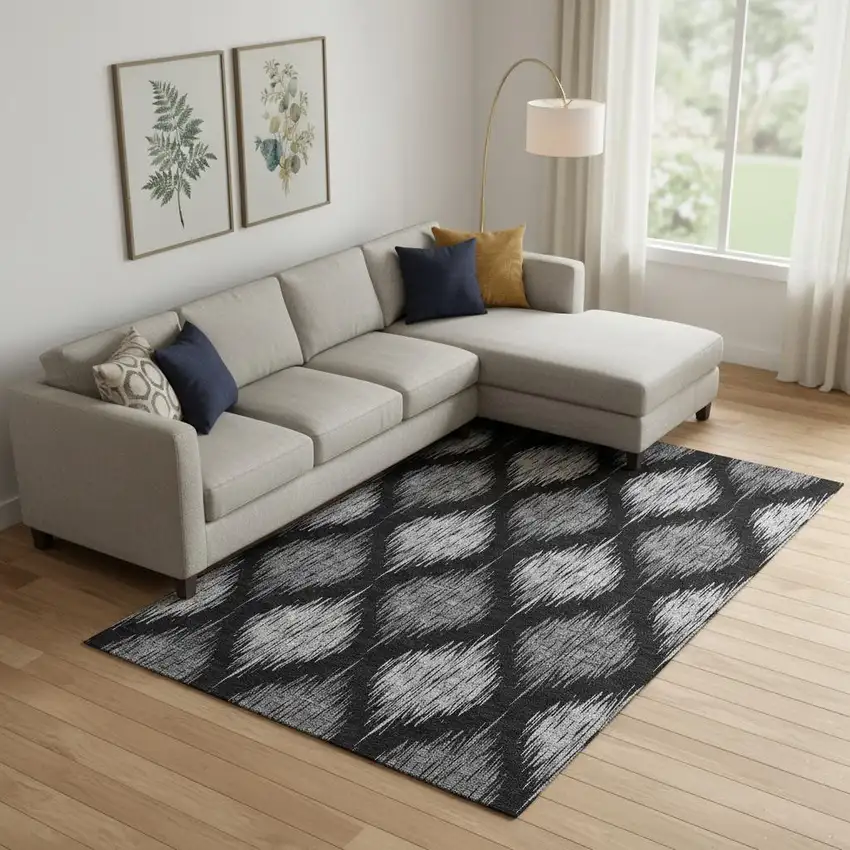 Black And Ivory Ikat Washable Area Rug With UV Protection Photo 1