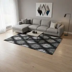 Photo of Black And Ivory Ikat Washable Area Rug With UV Protection
