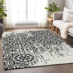 Photo of Black And Ivory Medallion Washable Area Rug With UV Protection