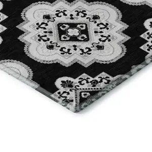Photo of Black And Ivory Medallion Washable Area Rug With UV Protection