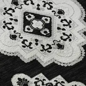 Photo of Black And Ivory Medallion Washable Area Rug With UV Protection